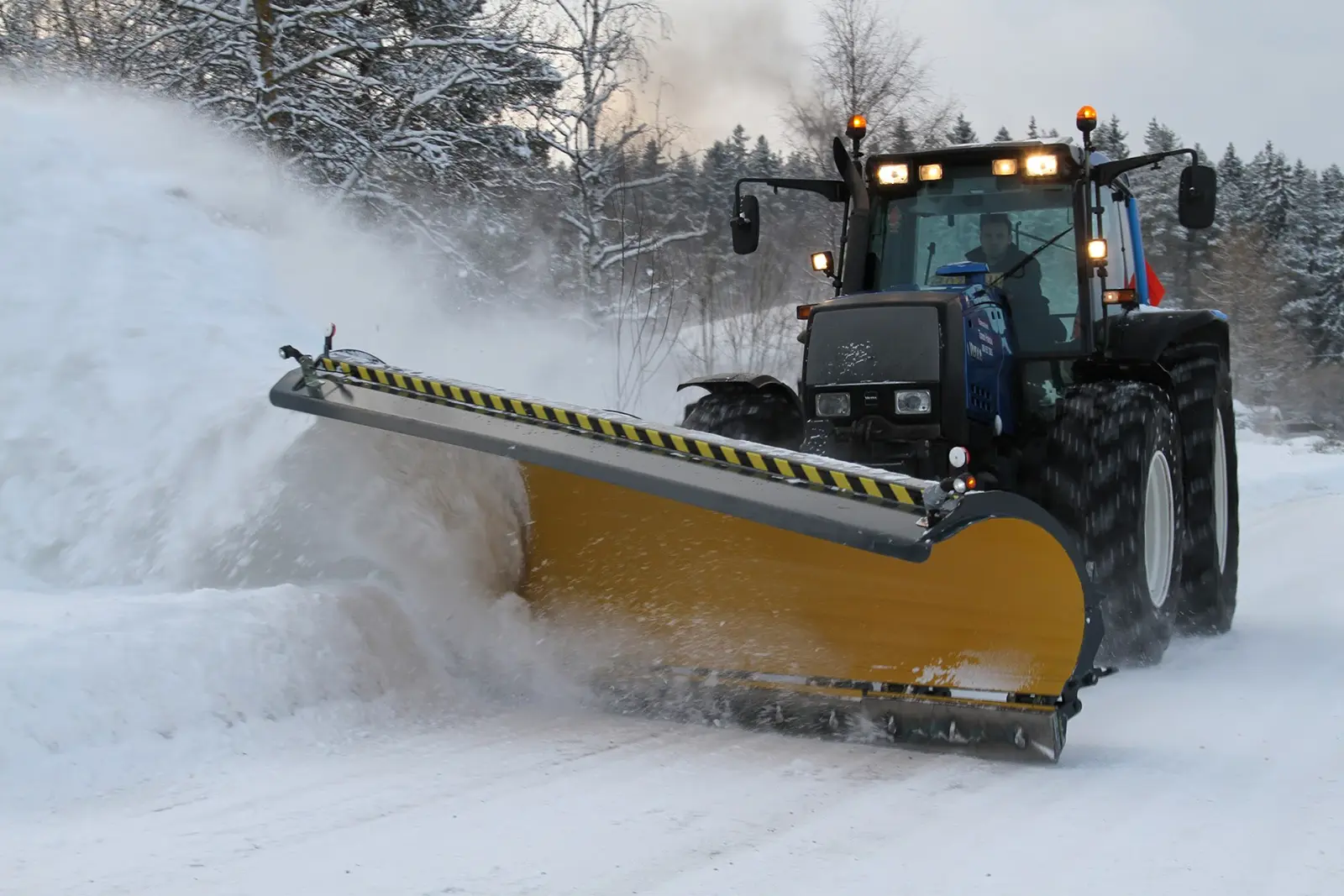 Stark Diagonal Plow in action plowing snow